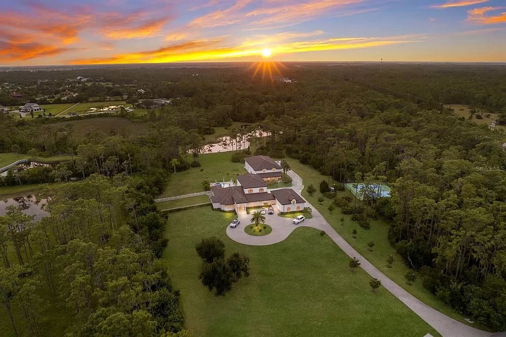 Nestled within the prestigious equestrian community of Foxwood at Panther Ridge, this extraordinary 13-acre estate offers unparalleled luxury country living.