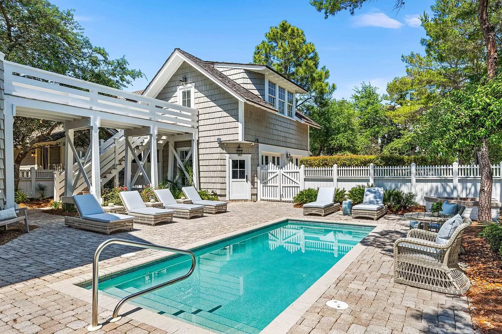 Welcome to an architectural masterpiece by Peter Block, where luxury meets seaside sophistication in this Nantucket-inspired residence.