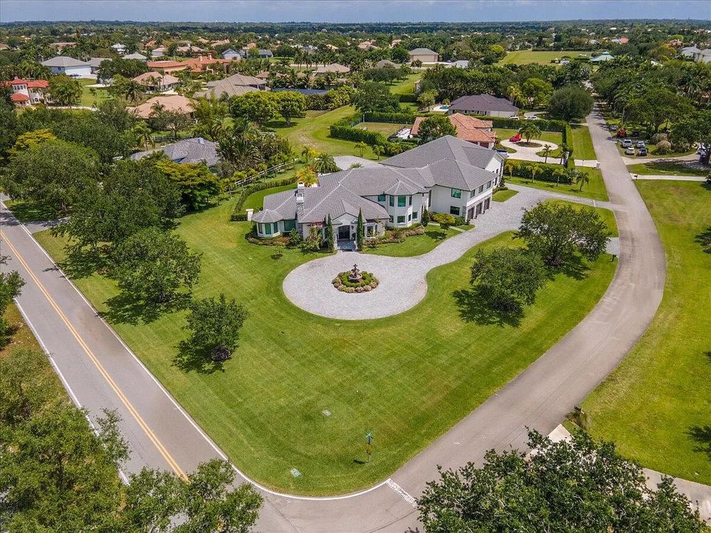 Welcome to this luxurious estate in the prestigious Aero Club. Featuring 7 bedrooms, 8 1/2 bathrooms, and 3 1/2 kitchens, this home is designed for ultimate comfort.