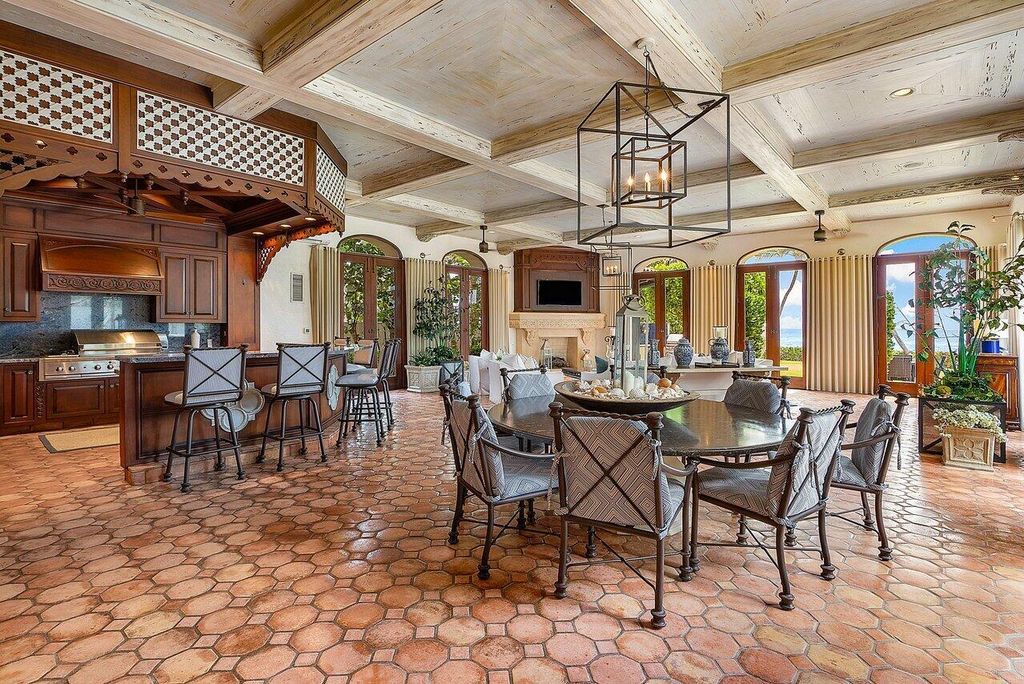 This exquisite estate, built by renowned Dan Swanson, offers breathtaking views of South Florida's coastline.