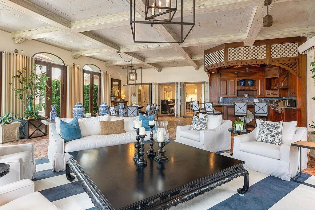 This exquisite estate, built by renowned Dan Swanson, offers breathtaking views of South Florida's coastline.