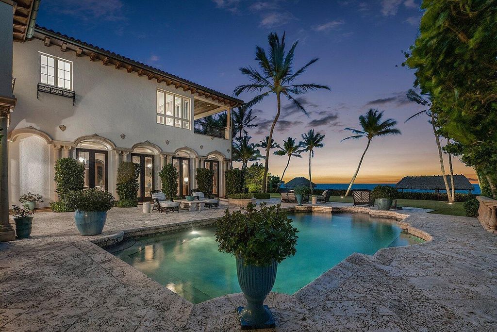 This exquisite estate, built by renowned Dan Swanson, offers breathtaking views of South Florida's coastline.