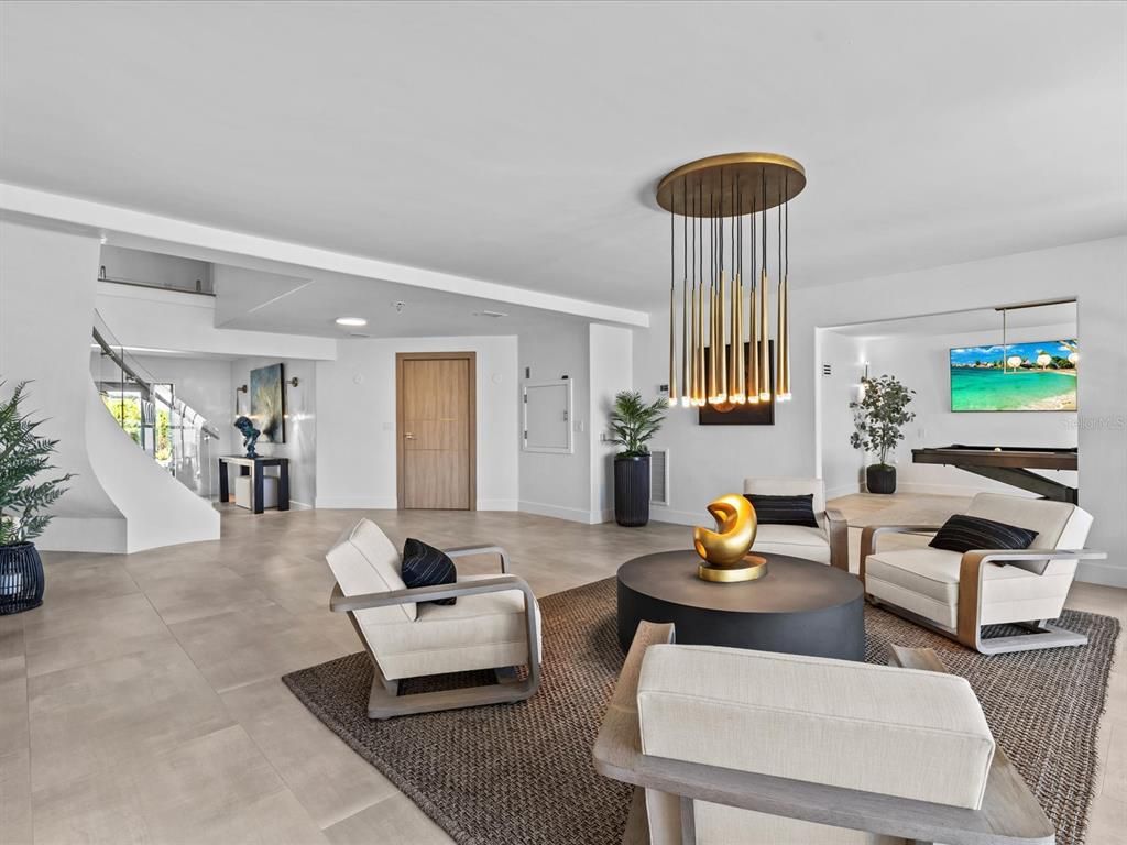 Enjoy modern elegance with breathtaking ocean views, a gourmet kitchen with marble countertops, a state-of-the-art water vapor fireplace, and over 10 TVs.