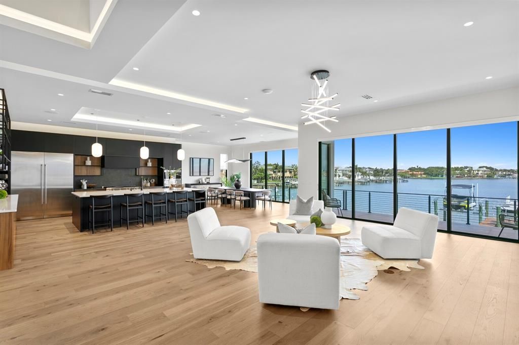 Completed in 2023 by Modesta Homes, this 8,766 square feet property offers 6 bedrooms, 5.5 baths, and sweeping water views.