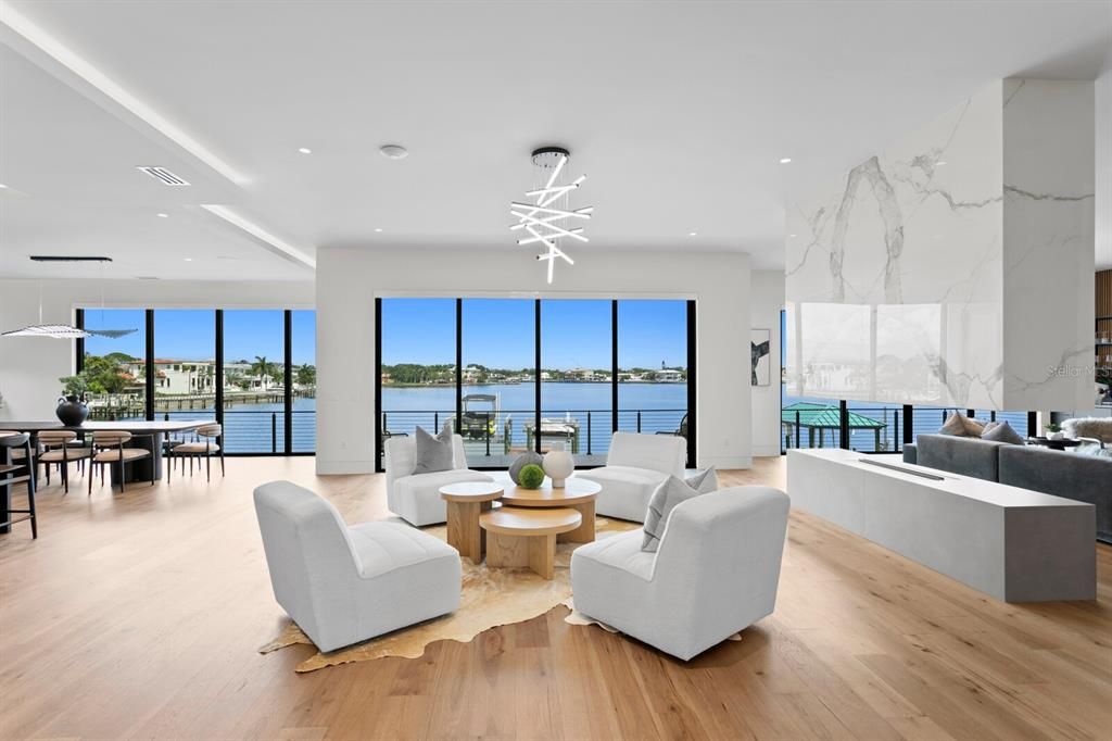 Completed in 2023 by Modesta Homes, this 8,766 square feet property offers 6 bedrooms, 5.5 baths, and sweeping water views.
