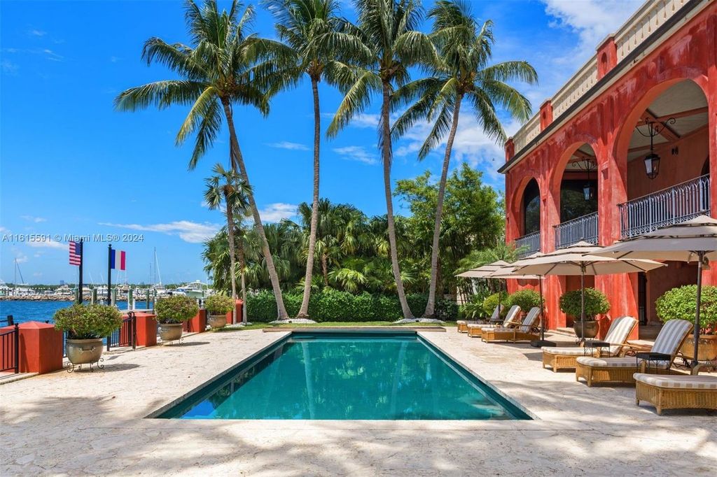 This extraordinary 3-story chateau-like waterfront estate offers 6,240 square feet of refined living space, featuring 7 lavish bedrooms and 8 opulent bathrooms.