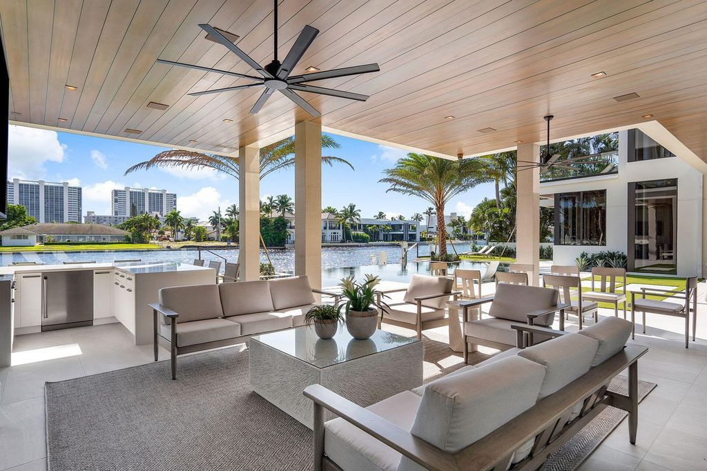 Experience elite Intracoastal living in this stunning turn-key Signature Estate by SRD Building Corp. Built in 2022, this 5-bedroom, 8-bath masterpiece spans over 8,200 square feet of luxurious living space, featuring a 4-car plus golf cart garage, resort-style pool, and 100 feet of prime waterfront with a private dock and Jet Ski lift.