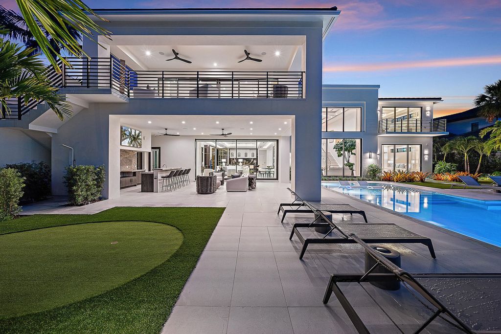 Discover the pinnacle of coastal luxury in this brand-new, open-concept transitional estate at 114 Quayside Dr, located within the prestigious Admirals Cove community in Jupiter, FL.