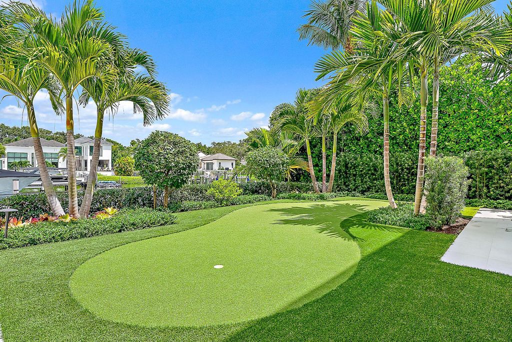 Discover the pinnacle of coastal luxury in this brand-new, open-concept transitional estate at 114 Quayside Dr, located within the prestigious Admirals Cove community in Jupiter, FL.