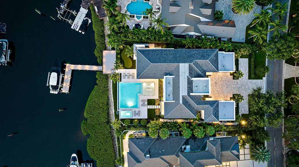 Discover the pinnacle of coastal luxury in this brand-new, open-concept transitional estate at 114 Quayside Dr, located within the prestigious Admirals Cove community in Jupiter, FL.