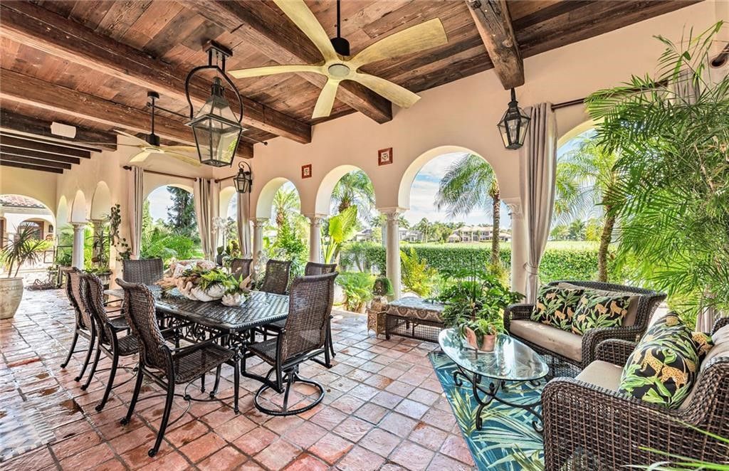 Welcome to Villa Groveland, a stunning Italian-inspired home in Quail West with breathtaking golf and lake views.