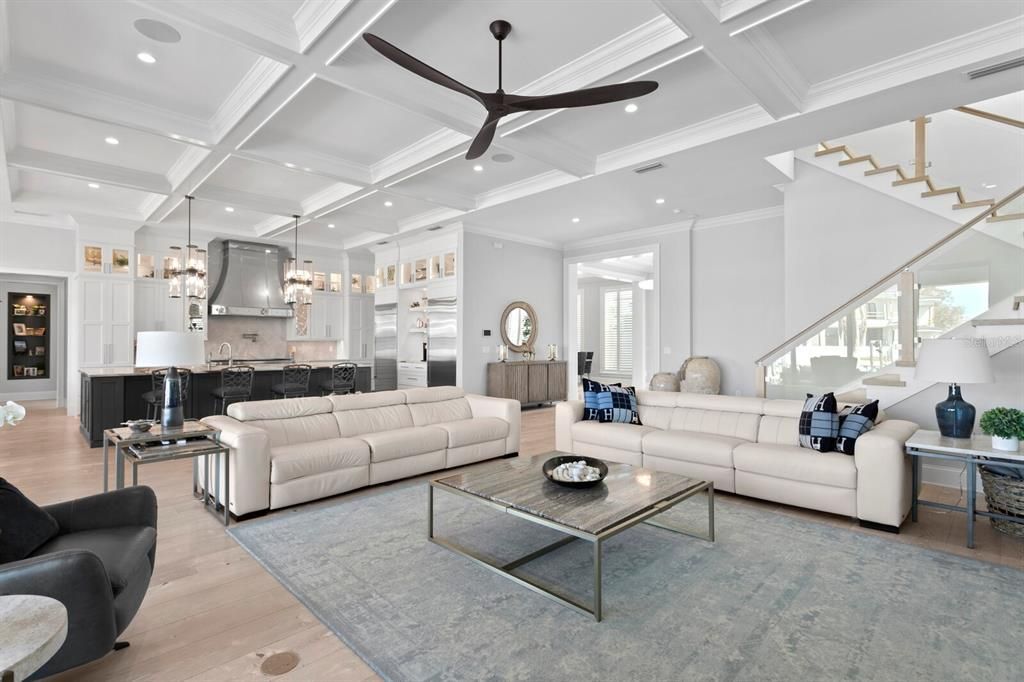 This newly built contemporary masterpiece features high vaulted ceilings, an open floor plan, and an elevator.