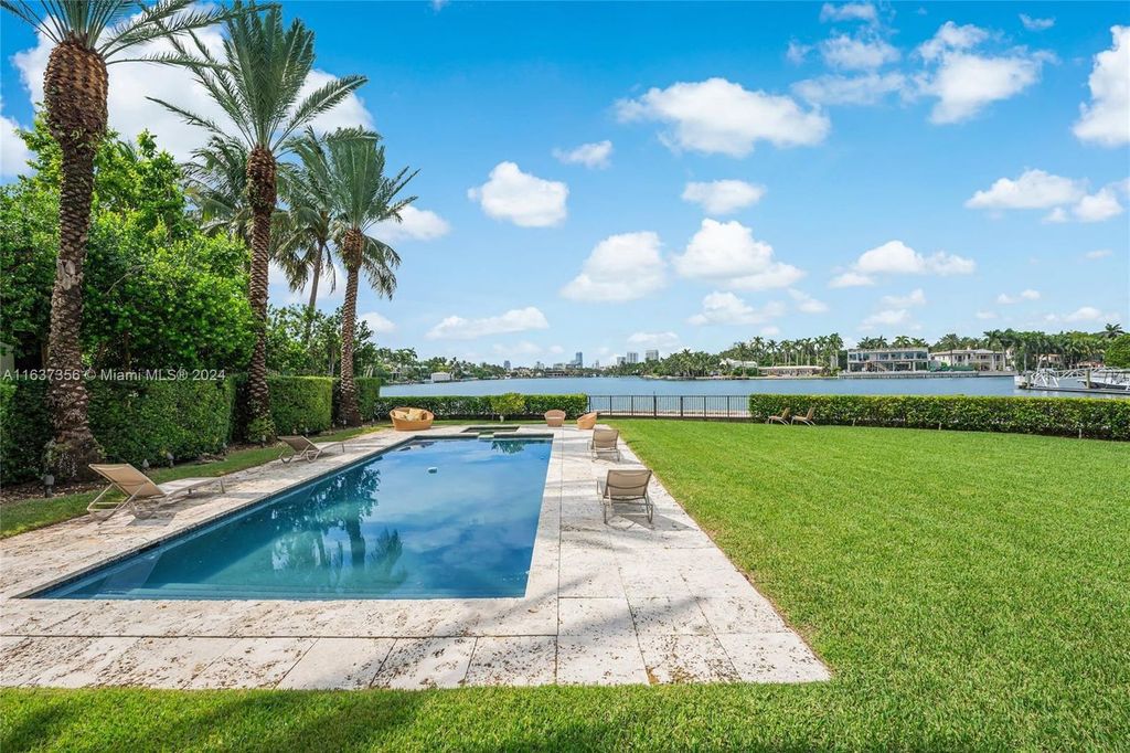 Perfectly nestled between prestigious North Bay Road and Sunset Island, this unique corner lot offers 325 feet of waterfrontage on Sunset Lake with breathtaking panoramic views.