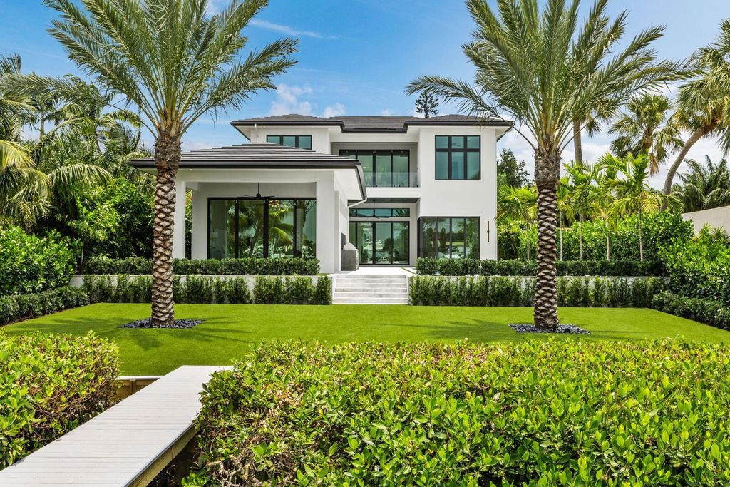 Discover unmatched luxury in this new, direct Intracoastal masterpiece on 0.63 acres.