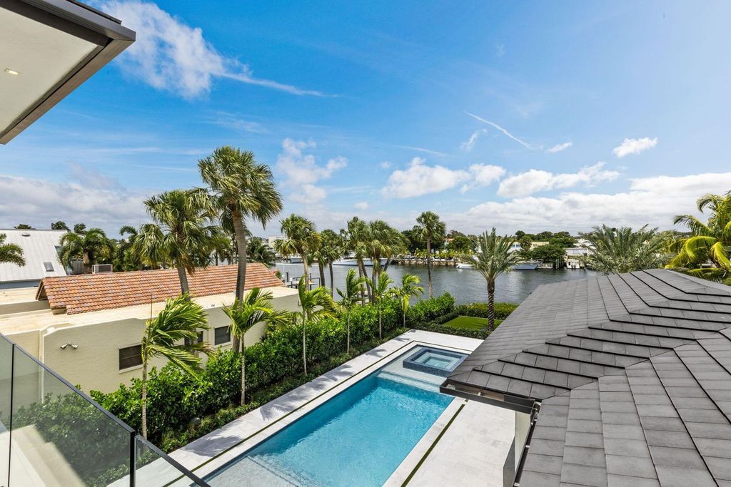 Discover unmatched luxury in this new, direct Intracoastal masterpiece on 0.63 acres.