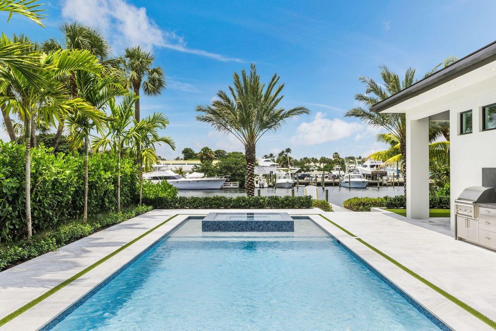 Discover unmatched luxury in this new, direct Intracoastal masterpiece on 0.63 acres.