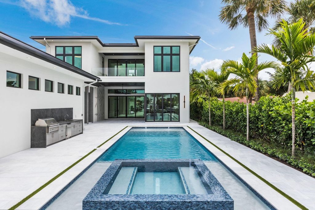 Discover unmatched luxury in this new, direct Intracoastal masterpiece on 0.63 acres.