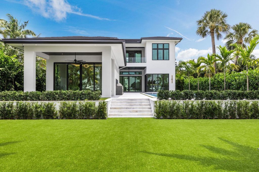 Discover unmatched luxury in this new, direct Intracoastal masterpiece on 0.63 acres.