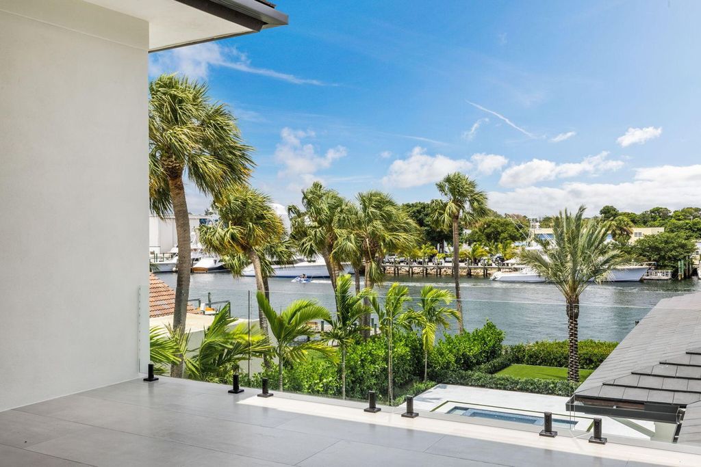 Discover unmatched luxury in this new, direct Intracoastal masterpiece on 0.63 acres.