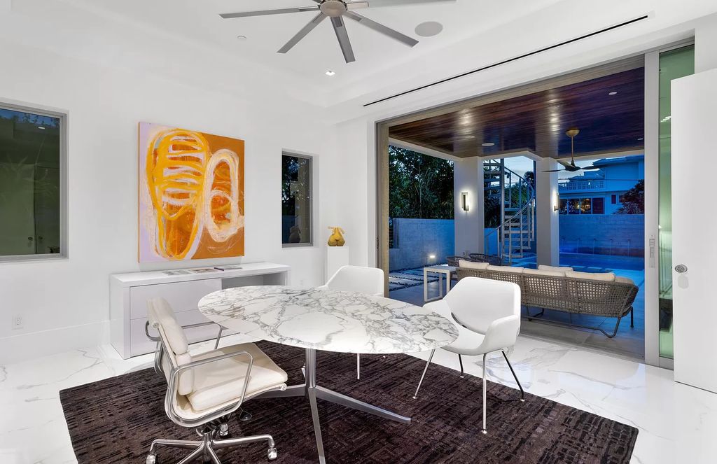 Just one block from the ocean, this 4-bed, 5-bath, 4,869 square feet residence features a Reina Sofia Museum-inspired glass-shaft elevator, balconies on each floor, and a roof terrace for an immersive coastal experience.