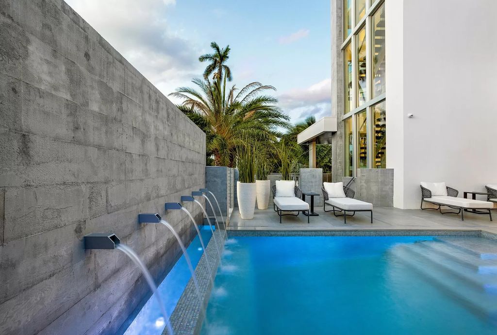 Just one block from the ocean, this 4-bed, 5-bath, 4,869 square feet residence features a Reina Sofia Museum-inspired glass-shaft elevator, balconies on each floor, and a roof terrace for an immersive coastal experience.