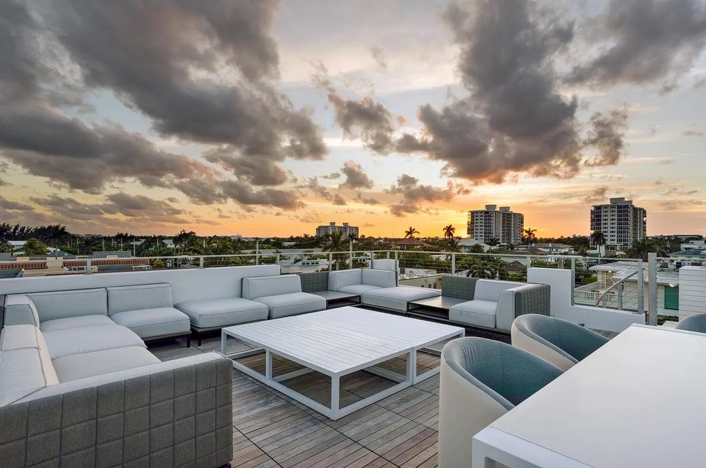 Just one block from the ocean, this 4-bed, 5-bath, 4,869 square feet residence features a Reina Sofia Museum-inspired glass-shaft elevator, balconies on each floor, and a roof terrace for an immersive coastal experience.