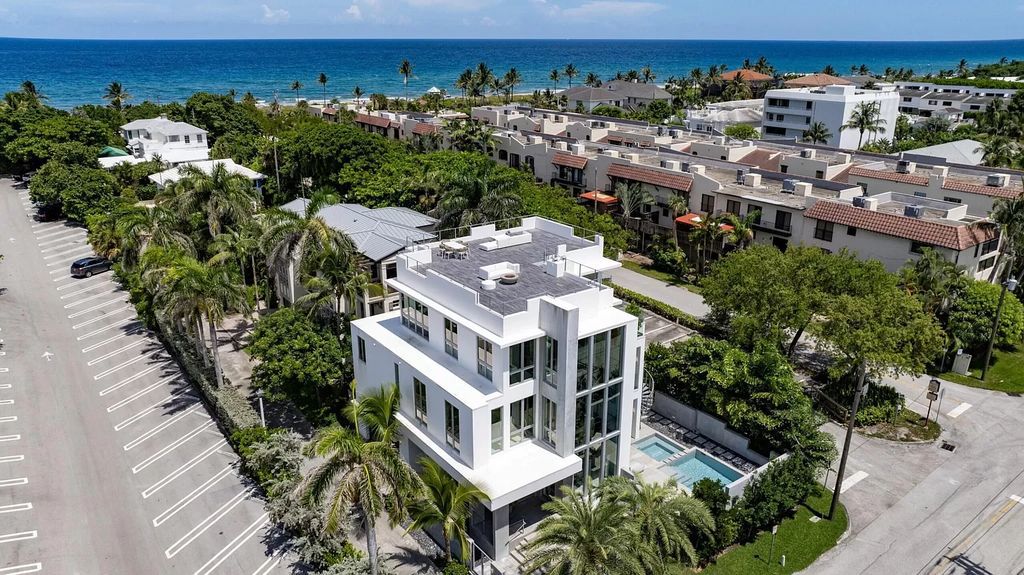 Just one block from the ocean, this 4-bed, 5-bath, 4,869 square feet residence features a Reina Sofia Museum-inspired glass-shaft elevator, balconies on each floor, and a roof terrace for an immersive coastal experience.