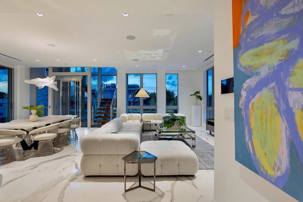 Just one block from the ocean, this 4-bed, 5-bath, 4,869 square feet residence features a Reina Sofia Museum-inspired glass-shaft elevator, balconies on each floor, and a roof terrace for an immersive coastal experience.