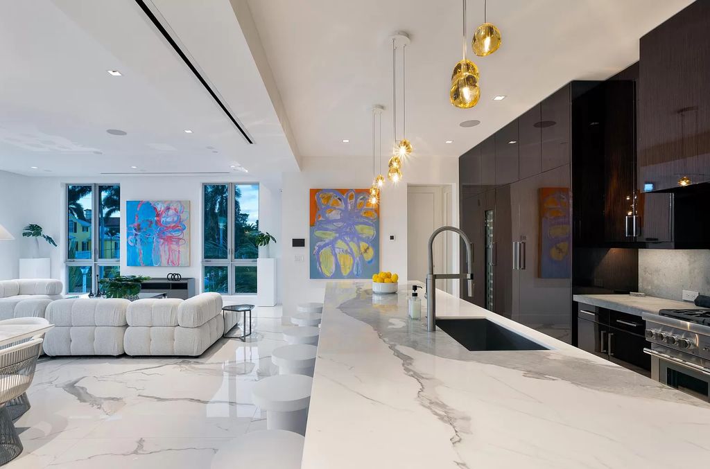 Just one block from the ocean, this 4-bed, 5-bath, 4,869 square feet residence features a Reina Sofia Museum-inspired glass-shaft elevator, balconies on each floor, and a roof terrace for an immersive coastal experience.