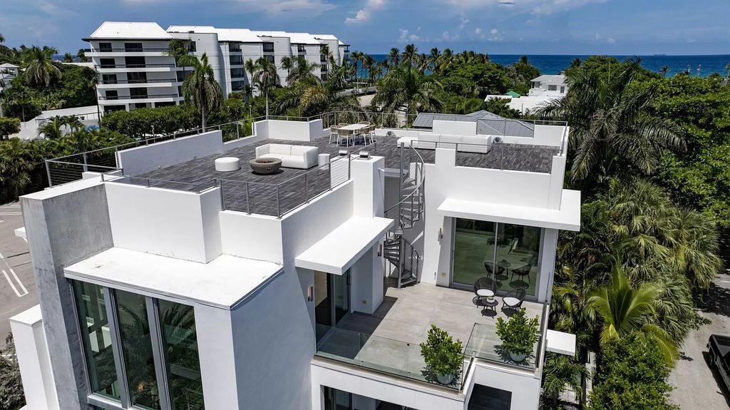 Just one block from the ocean, this 4-bed, 5-bath, 4,869 square feet residence features a Reina Sofia Museum-inspired glass-shaft elevator, balconies on each floor, and a roof terrace for an immersive coastal experience.