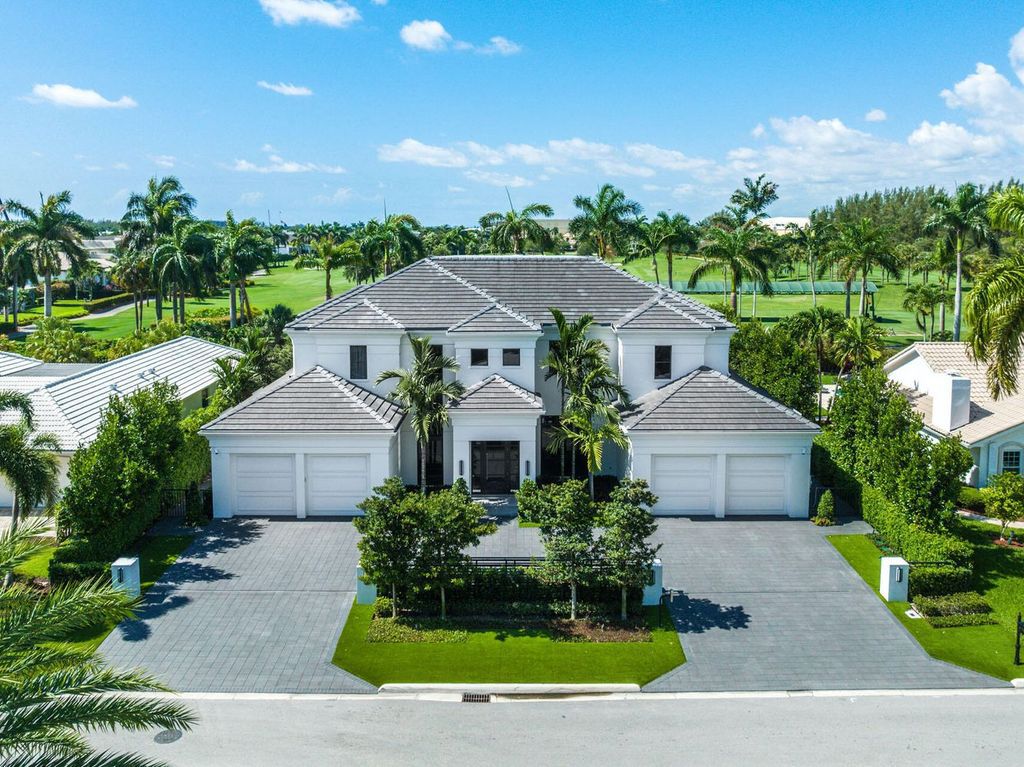 Offering 102 feet of prime golf course frontage, this contemporary 5-bedroom, 7-bath home boasts over 7,200 square feet of luxurious living space.