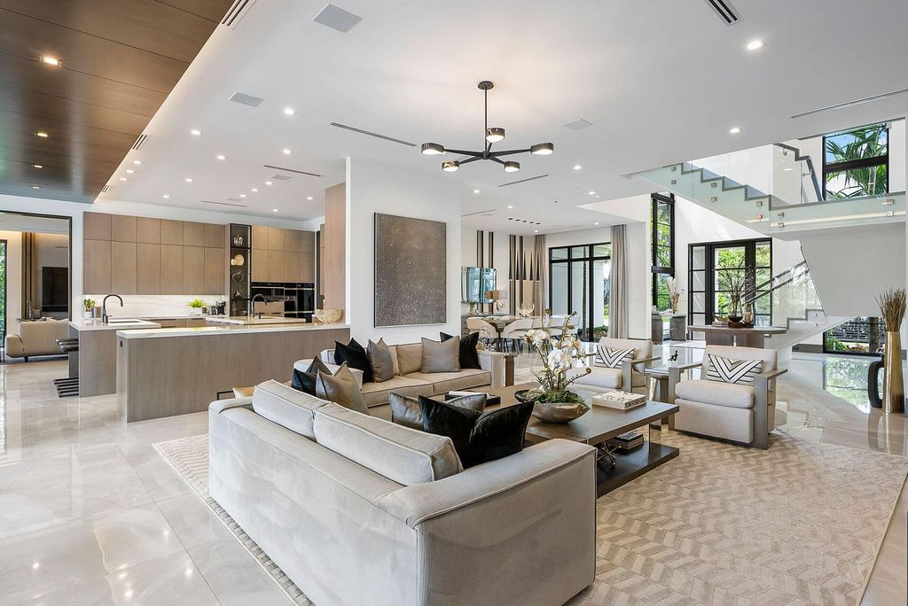 Offering 102 feet of prime golf course frontage, this contemporary 5-bedroom, 7-bath home boasts over 7,200 square feet of luxurious living space.