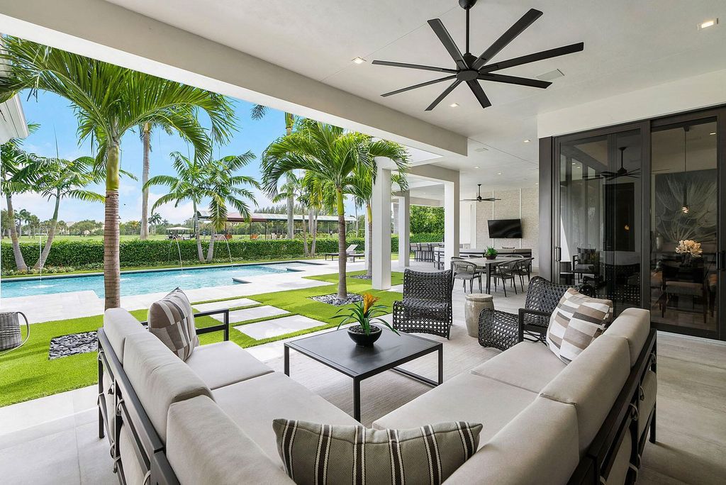 Offering 102 feet of prime golf course frontage, this contemporary 5-bedroom, 7-bath home boasts over 7,200 square feet of luxurious living space.