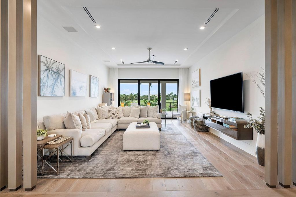 Offering 102 feet of prime golf course frontage, this contemporary 5-bedroom, 7-bath home boasts over 7,200 square feet of luxurious living space.