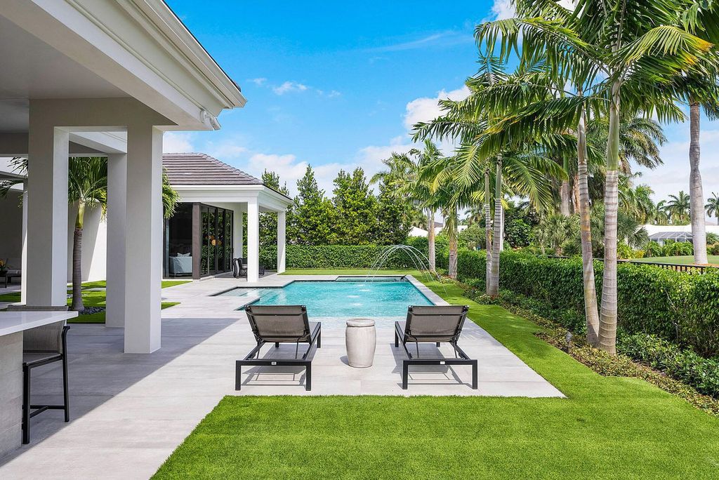 Offering 102 feet of prime golf course frontage, this contemporary 5-bedroom, 7-bath home boasts over 7,200 square feet of luxurious living space.