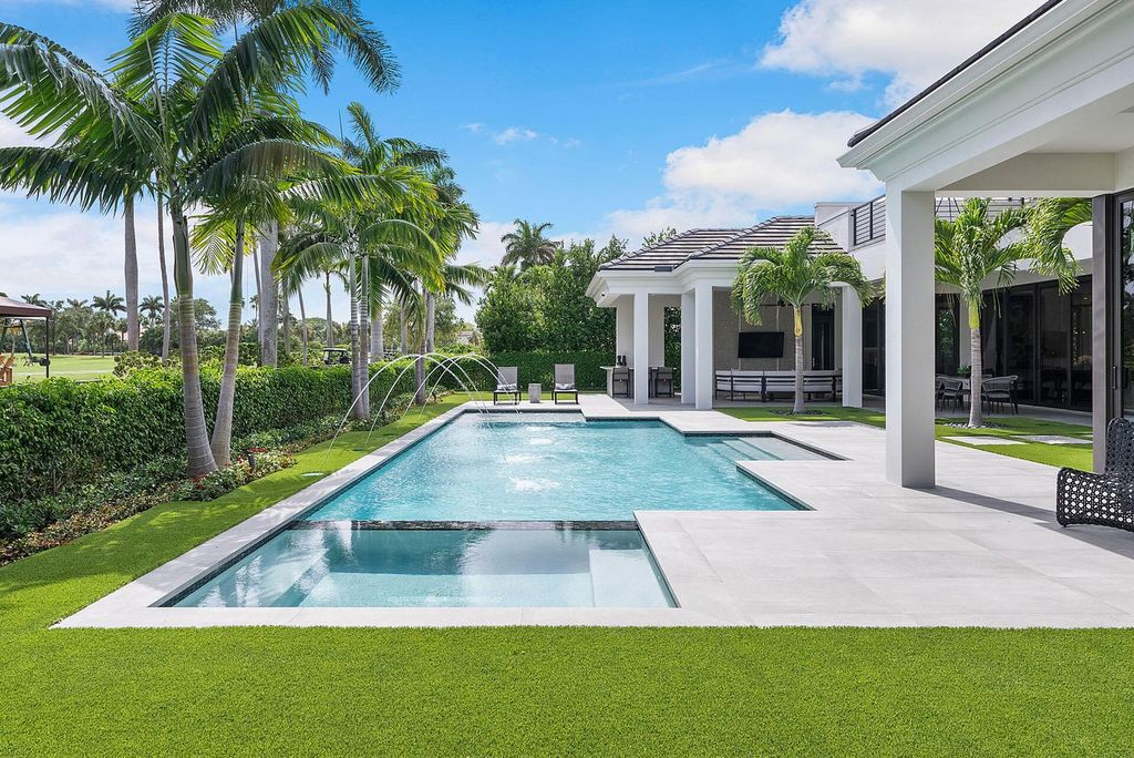 Offering 102 feet of prime golf course frontage, this contemporary 5-bedroom, 7-bath home boasts over 7,200 square feet of luxurious living space.