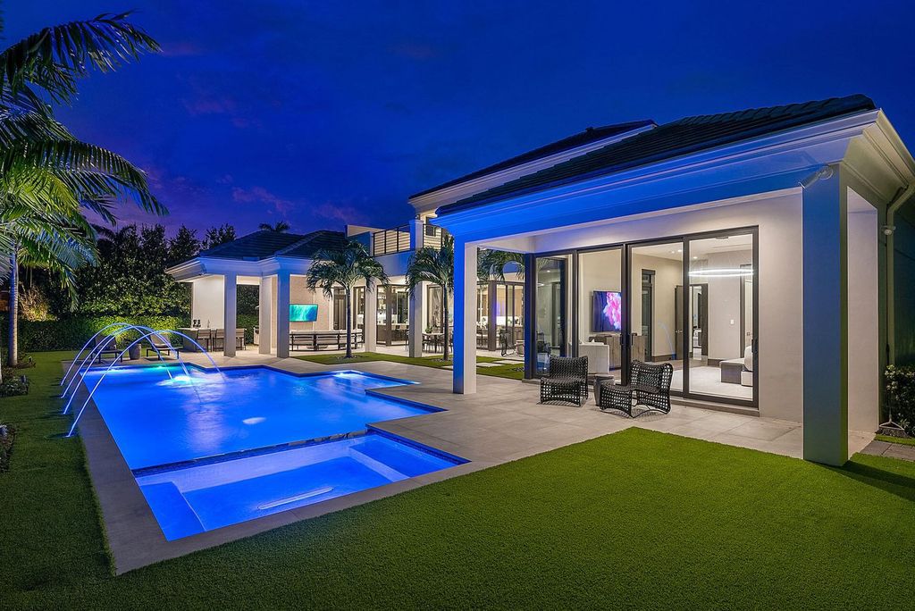 Offering 102 feet of prime golf course frontage, this contemporary 5-bedroom, 7-bath home boasts over 7,200 square feet of luxurious living space.