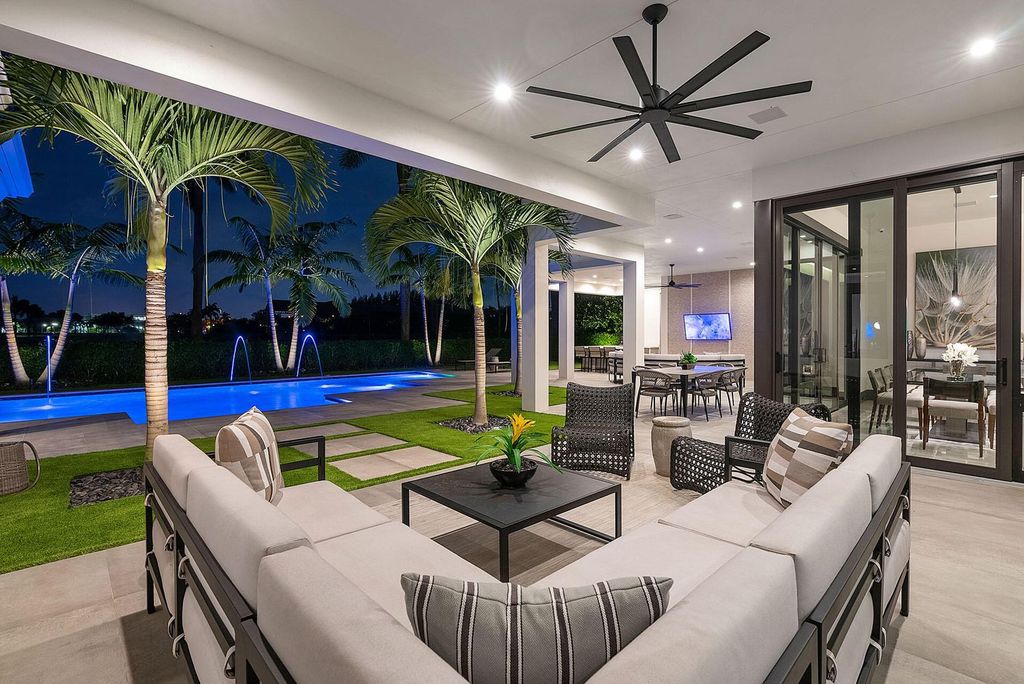 Offering 102 feet of prime golf course frontage, this contemporary 5-bedroom, 7-bath home boasts over 7,200 square feet of luxurious living space.