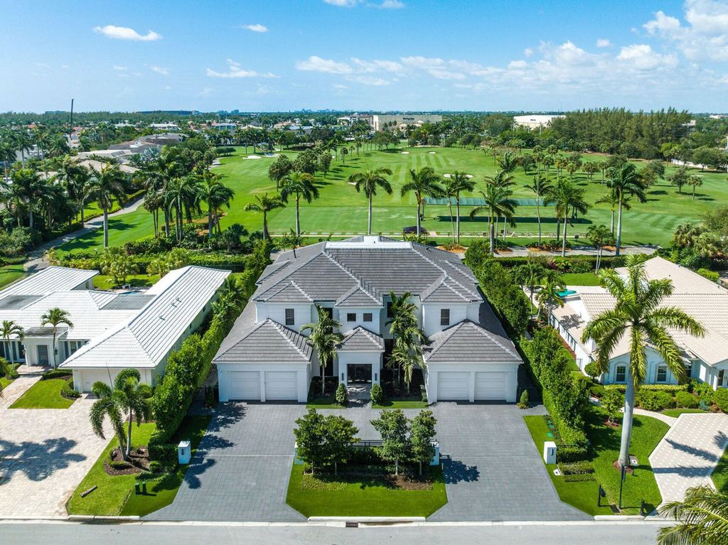 Offering 102 feet of prime golf course frontage, this contemporary 5-bedroom, 7-bath home boasts over 7,200 square feet of luxurious living space.