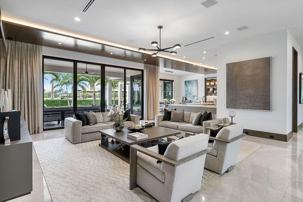 Offering 102 feet of prime golf course frontage, this contemporary 5-bedroom, 7-bath home boasts over 7,200 square feet of luxurious living space.