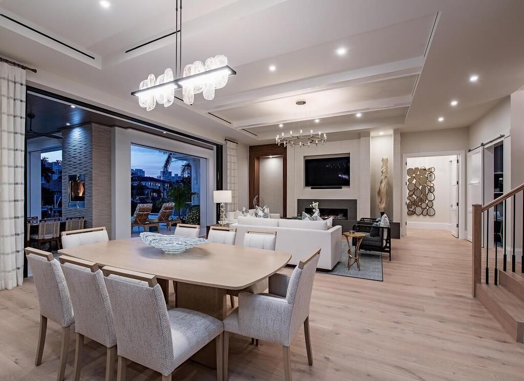 Designed by MHK Architecture and built by T.B. Price Builders, it features an open floor plan that includes a great room, dining area, gourmet kitchen, and a hidden caterer’s kitchen.