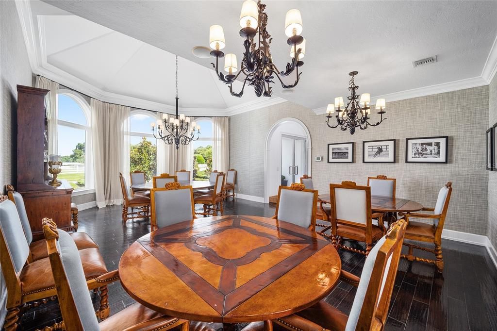 This 10,000 square feet main residence features 8 bedrooms, including separate caretaker's quarters, and boasts a grand foyer with 20-foot ceilings, a gourmet kitchen, and ample entertainment space.