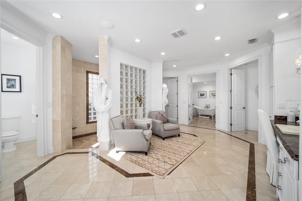 This 10,000 square feet main residence features 8 bedrooms, including separate caretaker's quarters, and boasts a grand foyer with 20-foot ceilings, a gourmet kitchen, and ample entertainment space.