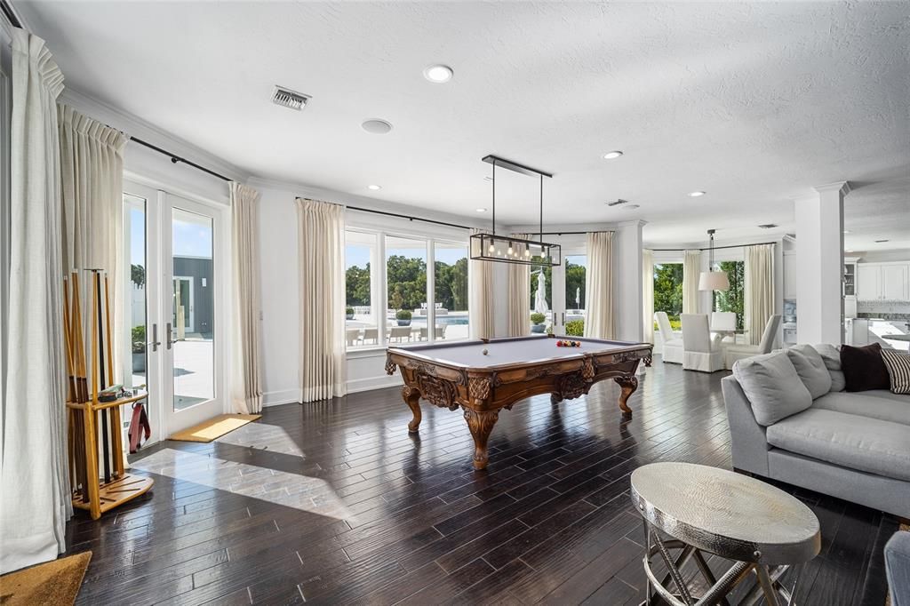 This 10,000 square feet main residence features 8 bedrooms, including separate caretaker's quarters, and boasts a grand foyer with 20-foot ceilings, a gourmet kitchen, and ample entertainment space.