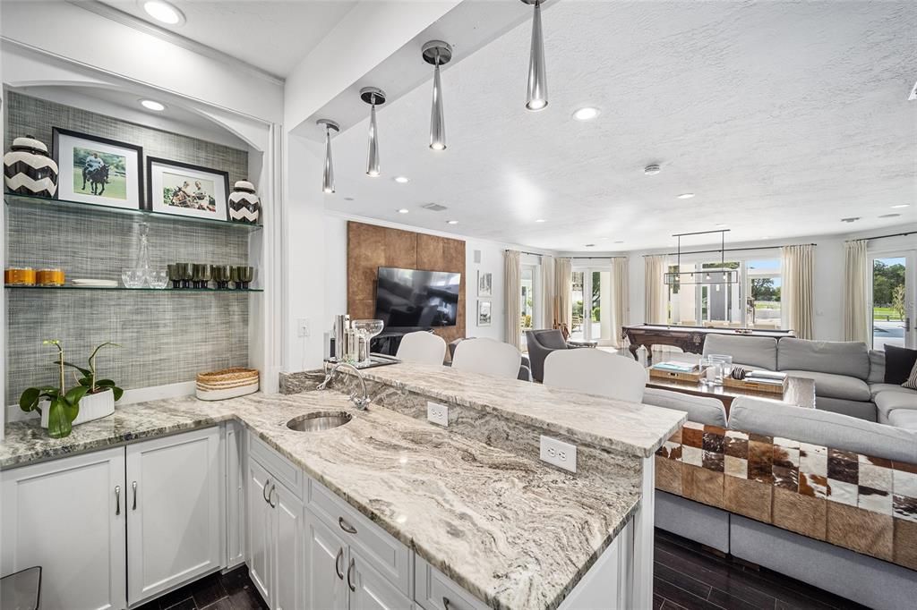 This 10,000 square feet main residence features 8 bedrooms, including separate caretaker's quarters, and boasts a grand foyer with 20-foot ceilings, a gourmet kitchen, and ample entertainment space.