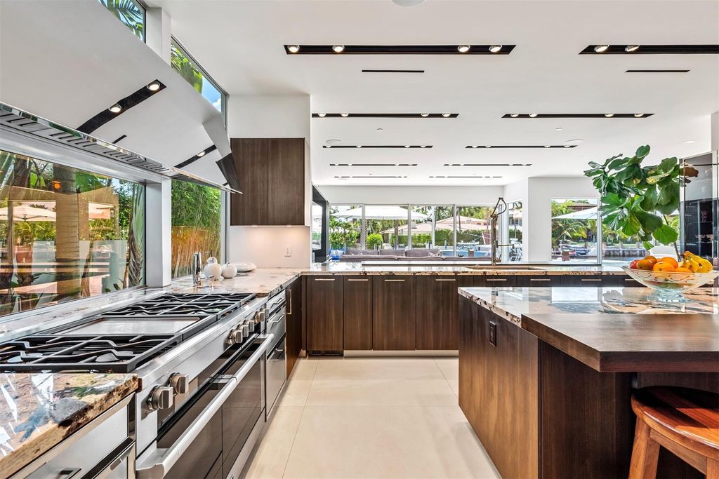 Experience the pinnacle of luxury living at this stunning contemporary estate, located in the prestigious guard-gated Harbor Beach community.