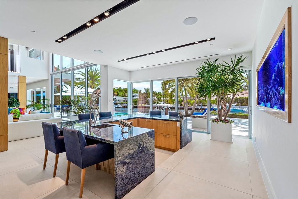 Experience the pinnacle of luxury living at this stunning contemporary estate, located in the prestigious guard-gated Harbor Beach community.