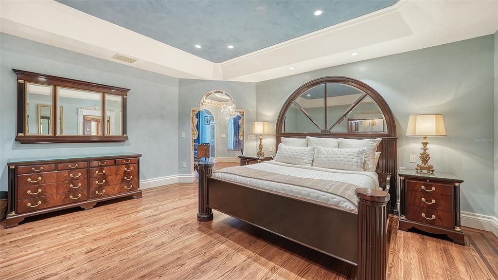 Featuring imported marble floors, Venetian plaster walls, and gold leaf moldings, the residence exudes Old World elegance. Enjoy breathtaking sunsets from terraces, gardens, or the Versace-inspired pool area.