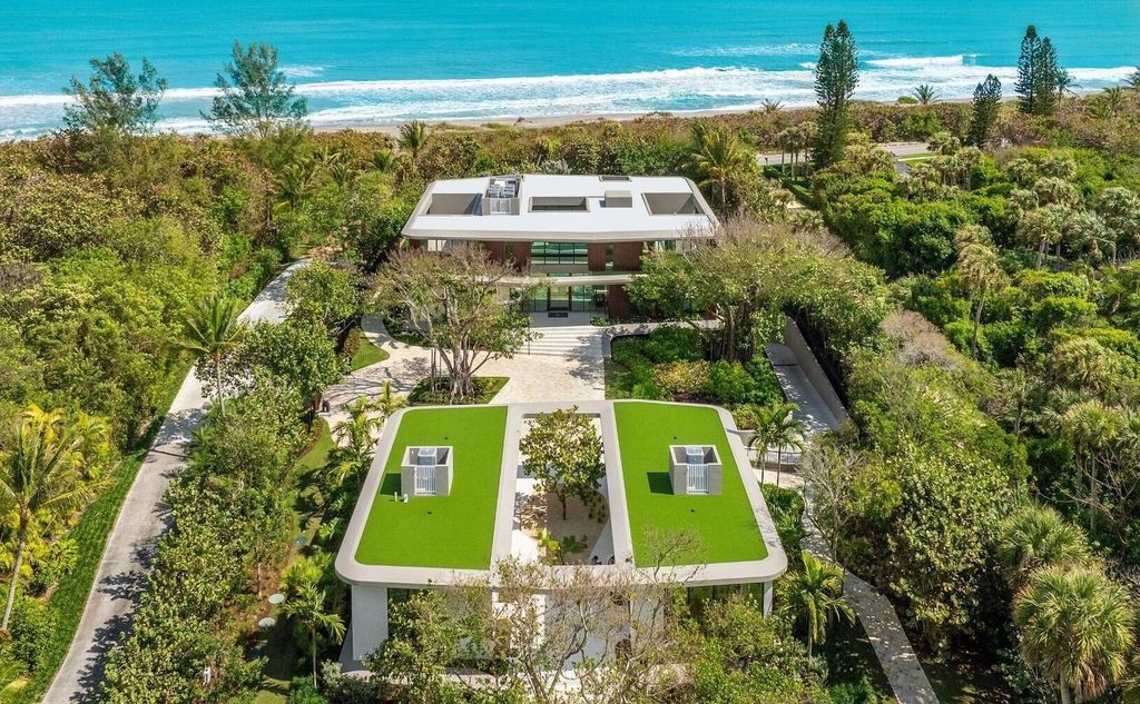 This exceptional oceanfront estate on Jupiter Island, crafted by DOMO Architecture and Design, offers 6 bedrooms, 8 baths, and 10,545 square feet of living space on 3.41 acres with 179 feet of ocean frontage.