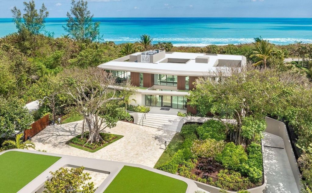 This exceptional oceanfront estate on Jupiter Island, crafted by DOMO Architecture and Design, offers 6 bedrooms, 8 baths, and 10,545 square feet of living space on 3.41 acres with 179 feet of ocean frontage.